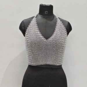 Silver chainmail halter crop top on mannequin with V-neck front, handcrafted from aluminum rings for Renaissance faire, cosplay, or music festival fashion.
